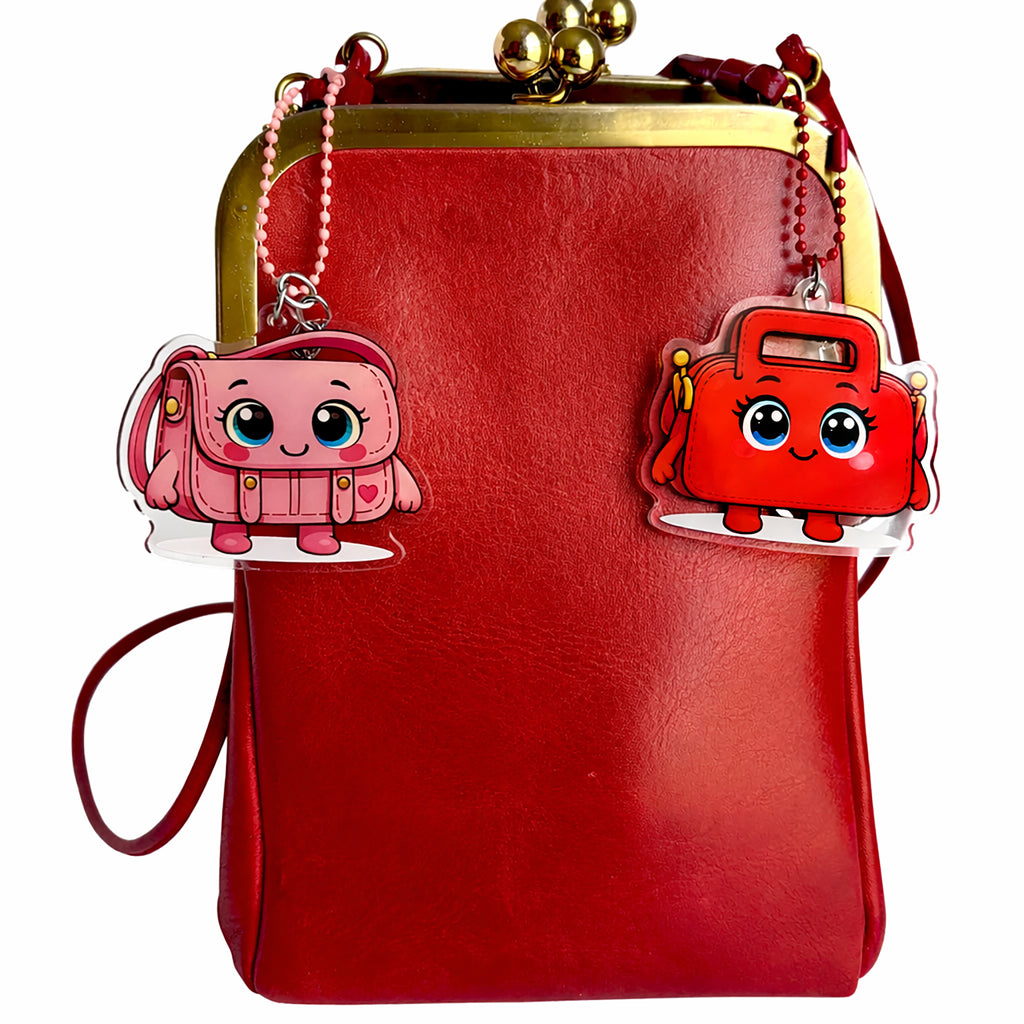 Red handbag with cartoon character charms on a white background