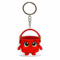 Red bucket keychain with a smiling face on a white background