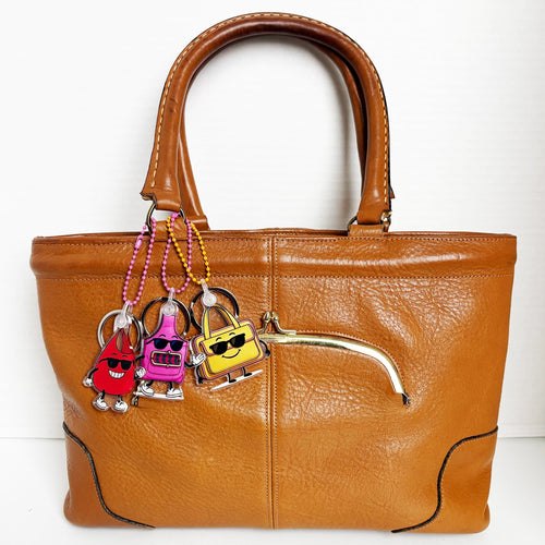 Charmlingz BB, Slingy and Saffe on vintage brown handbag