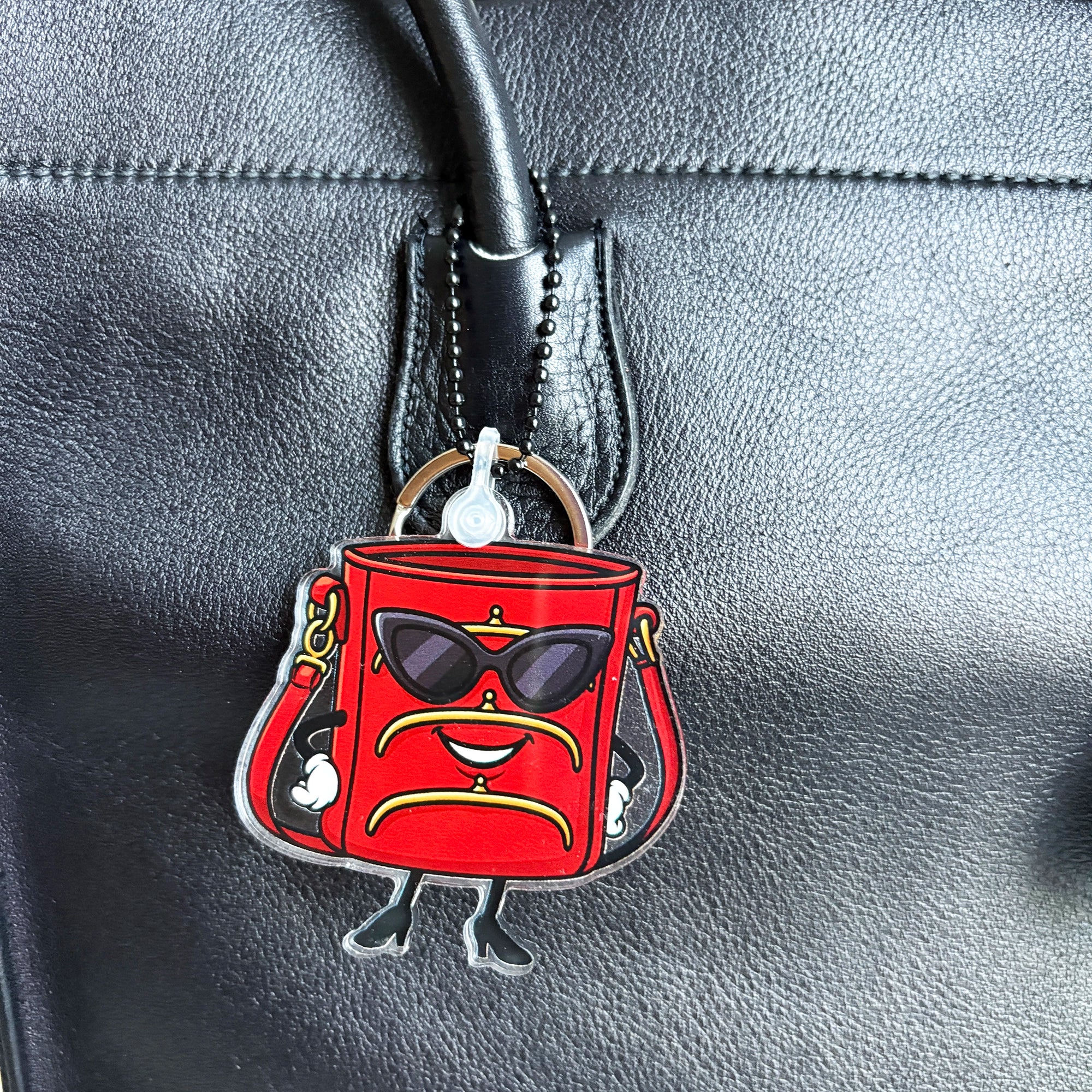 TriFramea Red bucket purse character keychain bag charm with sunglasses on bag