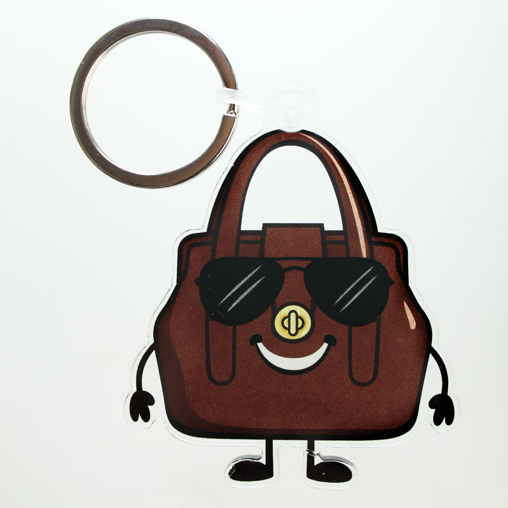 Brown handbag keychain bag charm with sunglasses on a white background