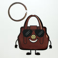 Brown handbag keychain bag charm with sunglasses on a white background
