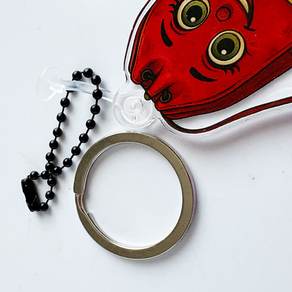 Clasp detail with removable key ring and ball chain.