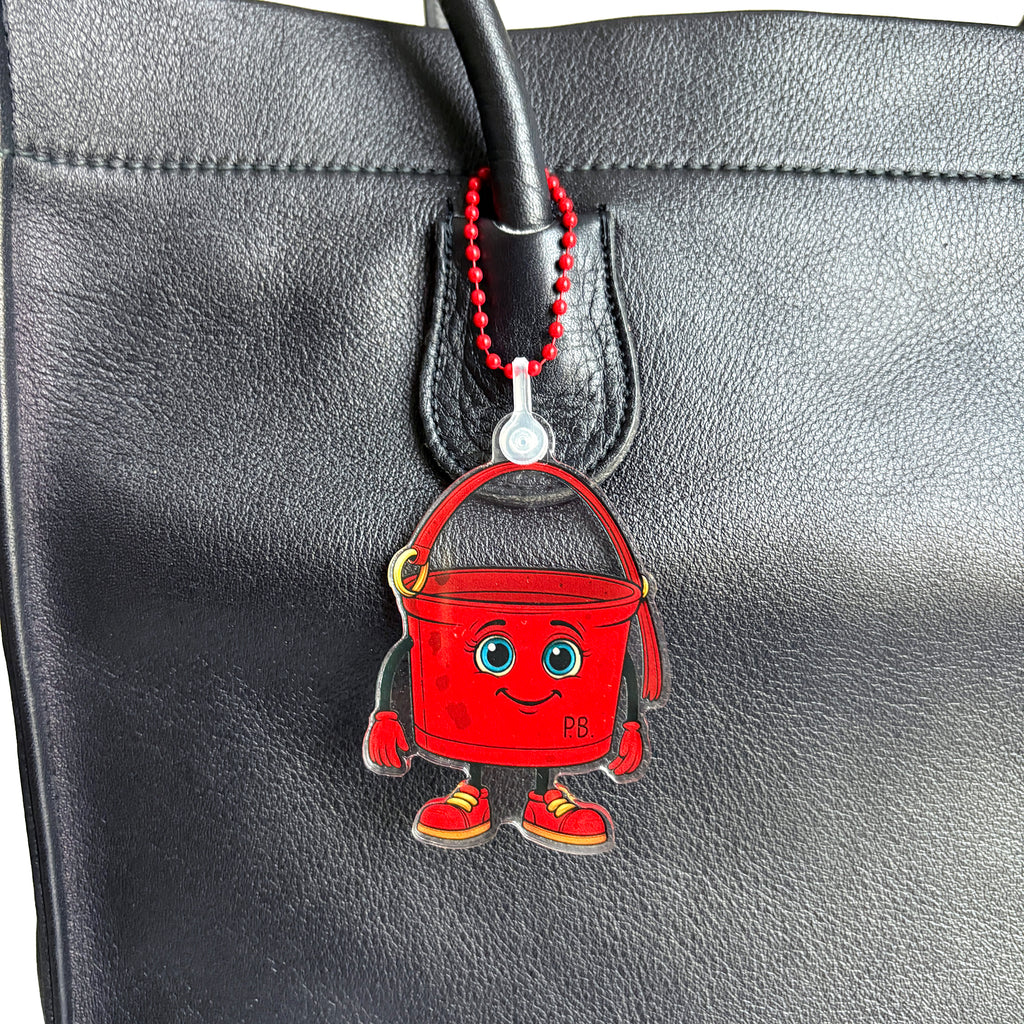 Close up of ReLuvable PB bag charm on vintage tote bag