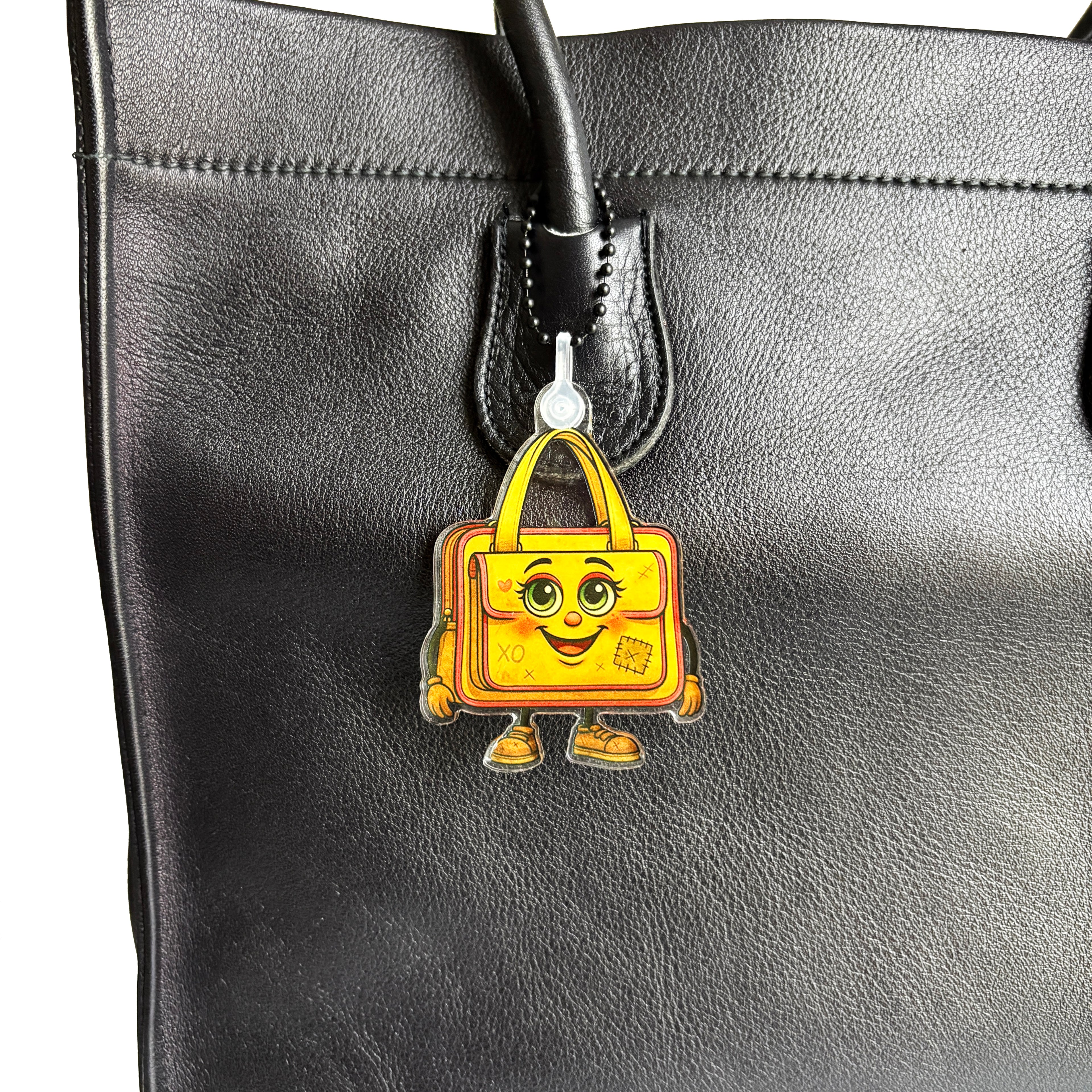 ReLuvable Bag Charm Ms Saffe closeup on vintage handbag.