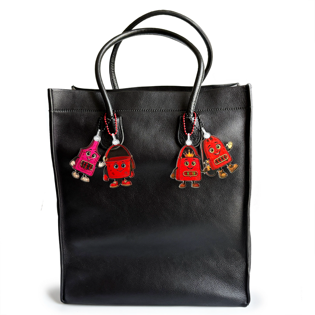 Black vintage tote bag with ReLuvable Charmlings bag charms shown for scale and styling inspiration.