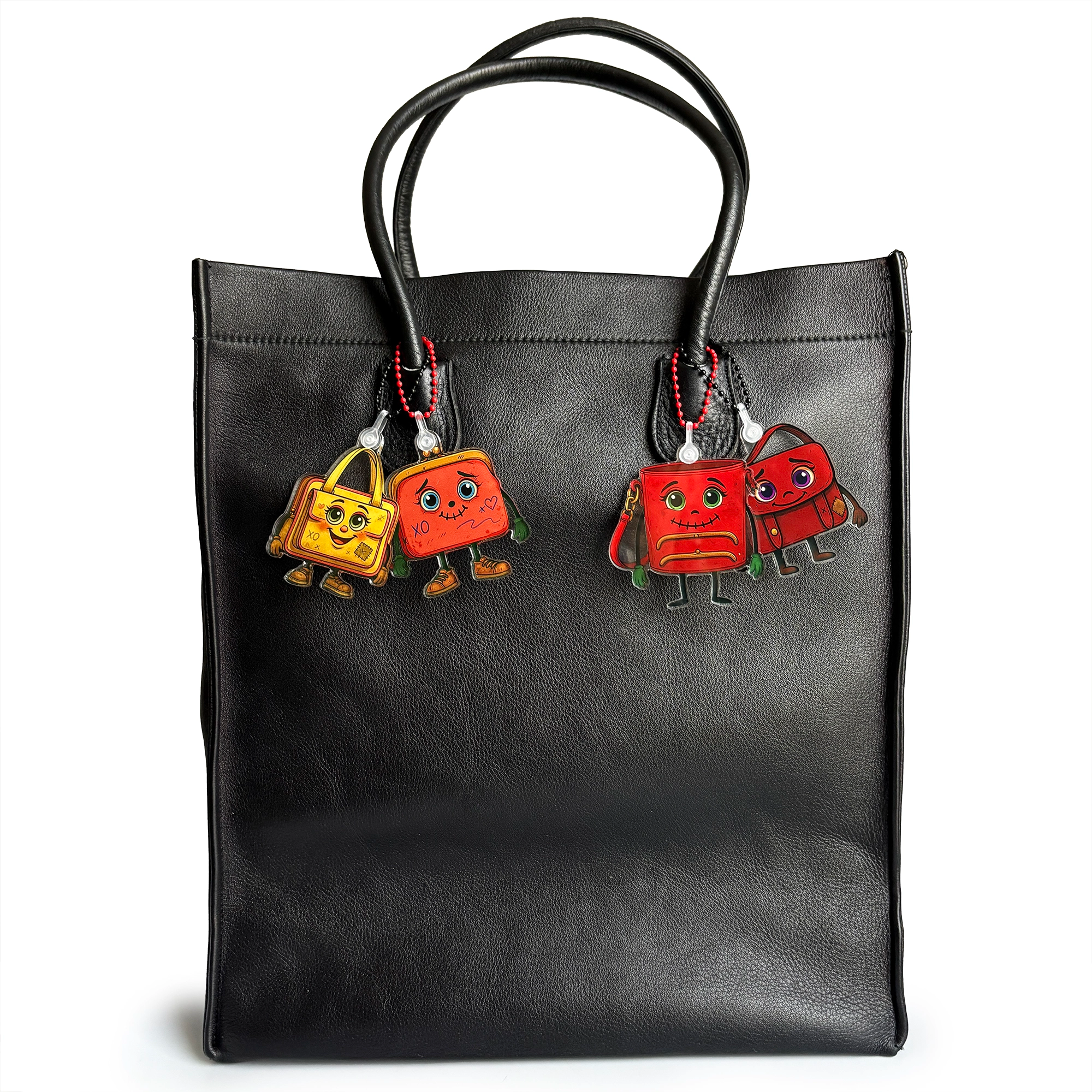 Black vintage tote bag with ReLuvable bag charms keychains TrFramea, Ms Saffe, Flopsy and Musey on a white background